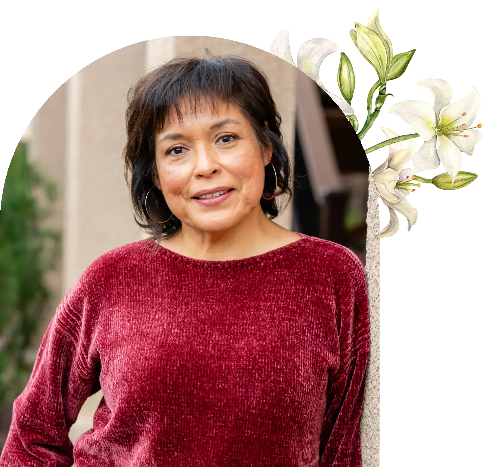 Woman in red velvet top with lily accents